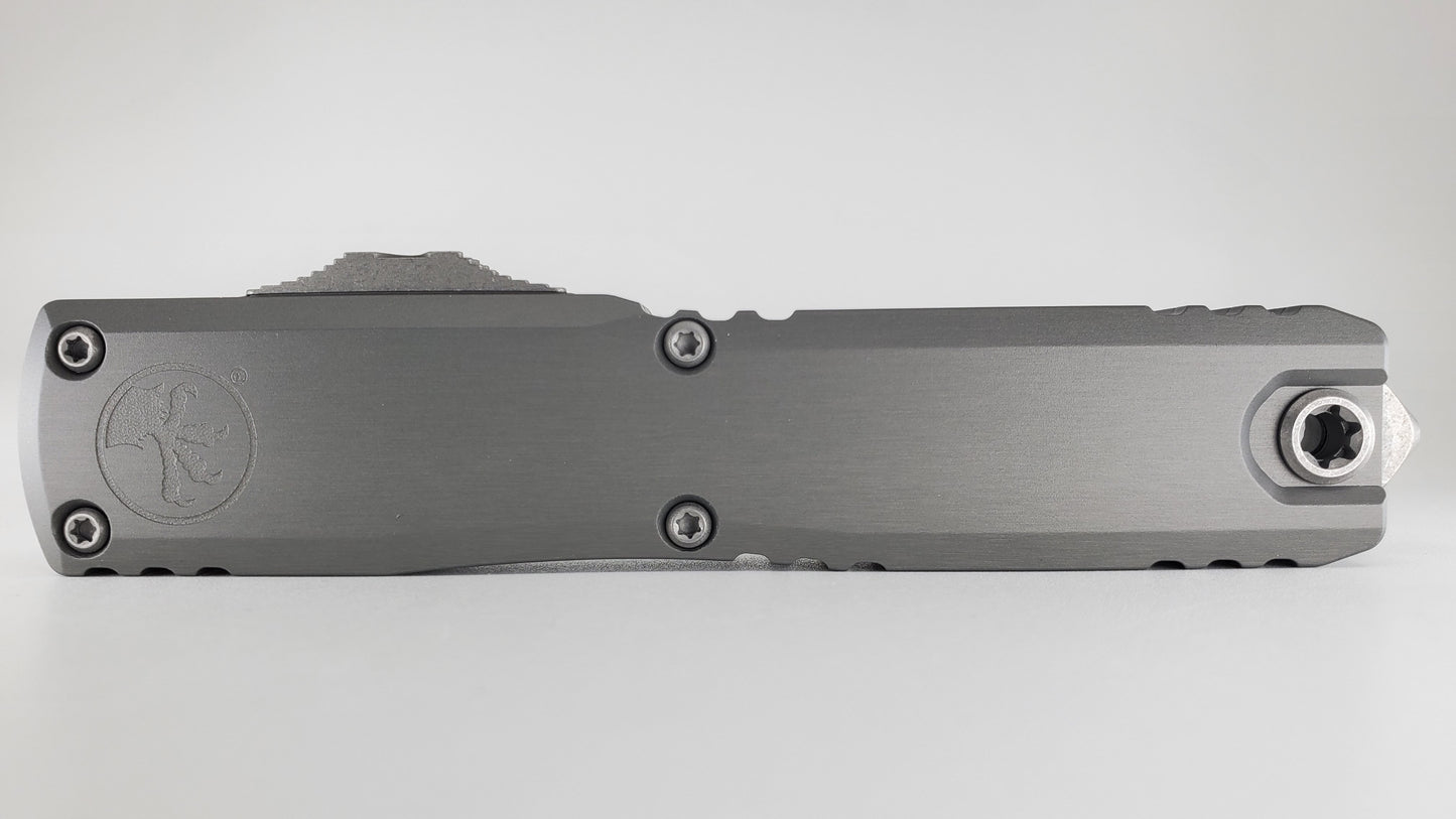 Microtech Ultratech ZBP S/E Natural Clear Apocalyptic Partial Serrated Out the Front Knife