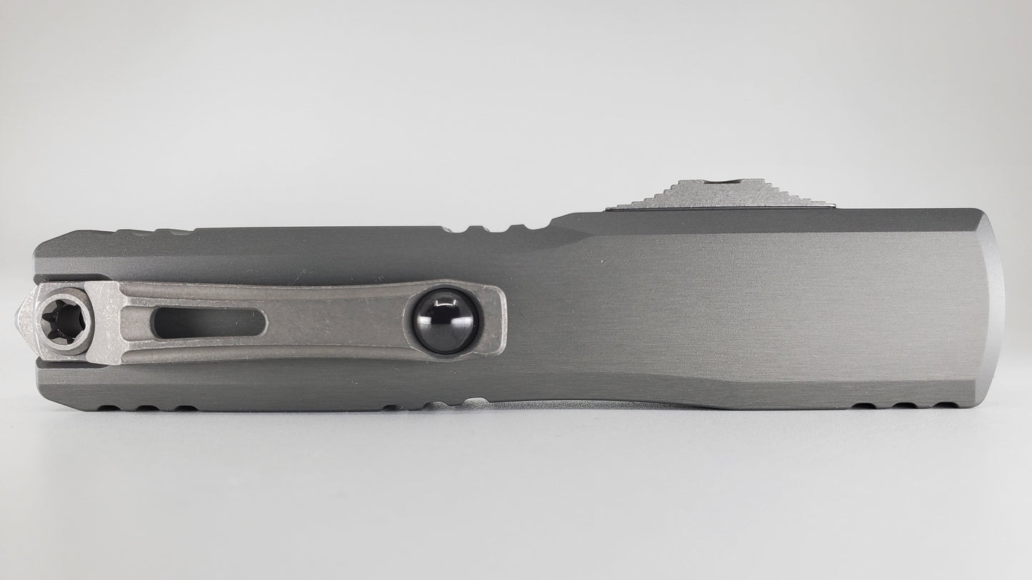 Microtech Ultratech ZBP S/E Natural Clear Apocalyptic Partial Serrated Out the Front Knife