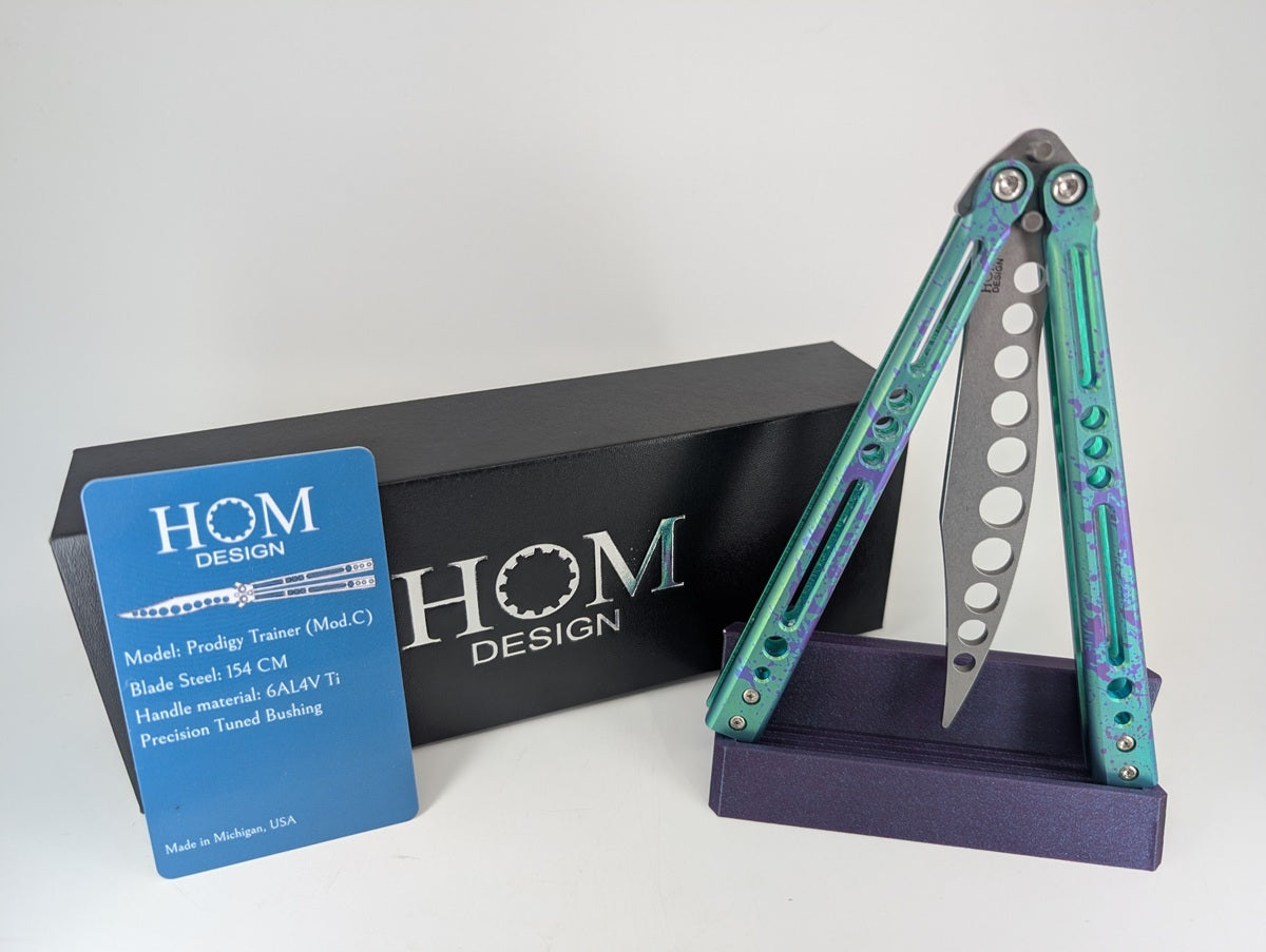HOM Design Prodigy Titanium Green w/ Purple Splatter Balisong Trainer Mod. C