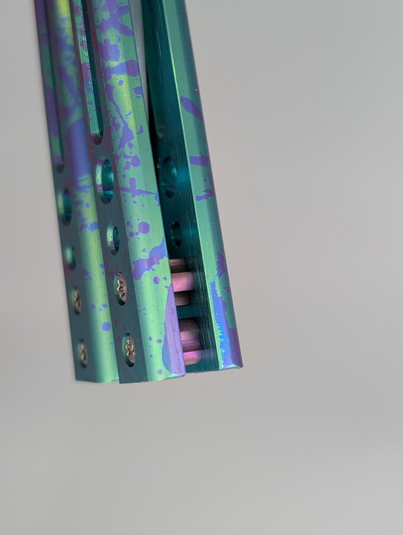 HOM Design Prodigy Titanium Green w/ Purple Splatter Balisong Trainer Mod. C