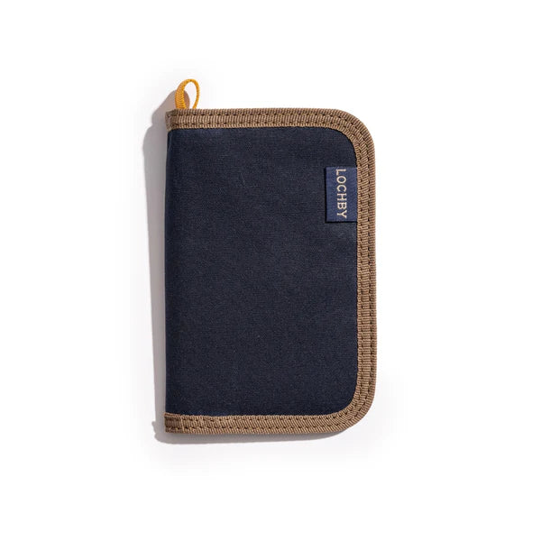 Navy zippered pouch with brown border and Lochby label on a white background