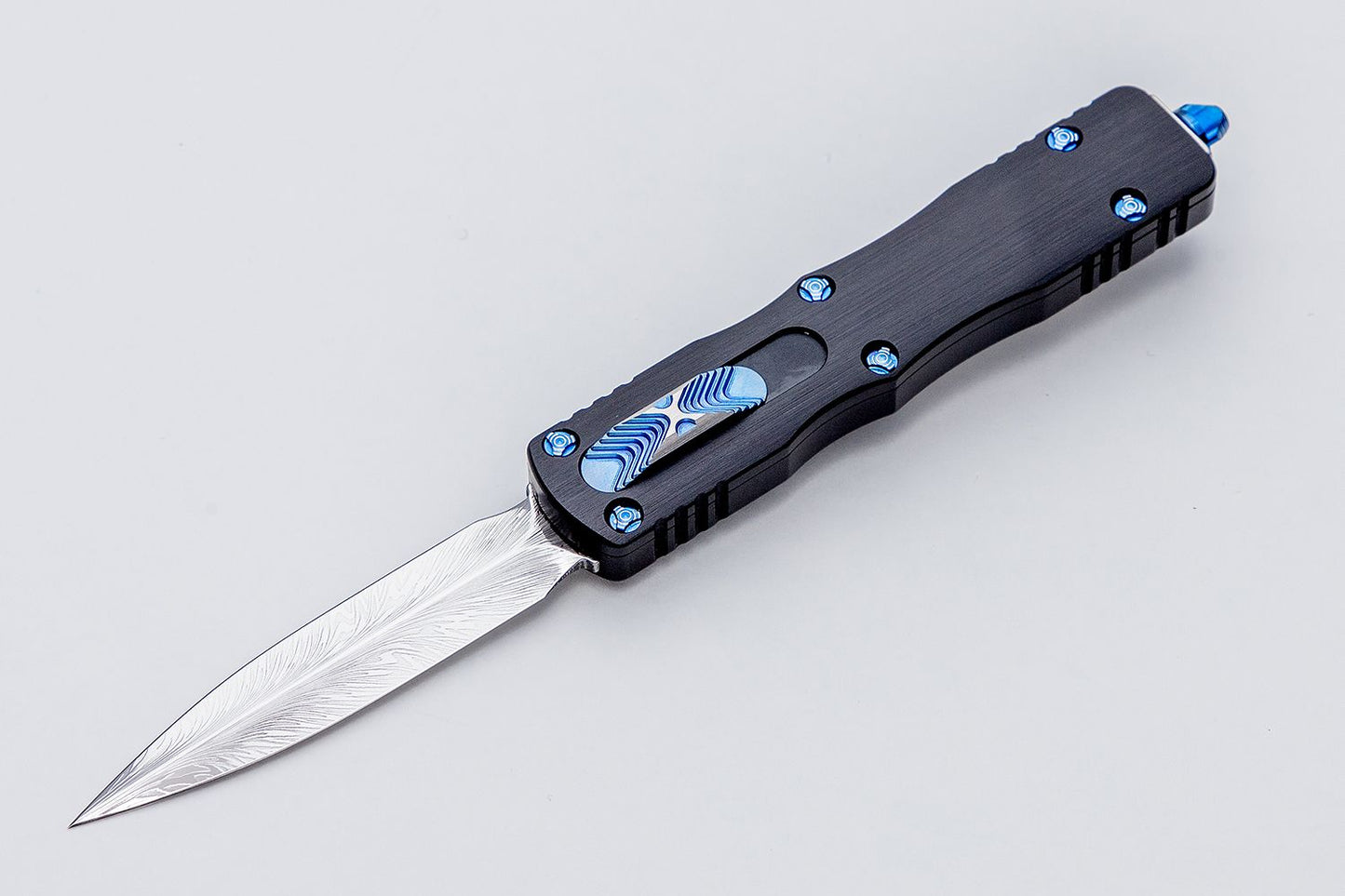 Microtech Dirac Marfione Custom Polished Vegas Feather Damascus Blue Ti Hardware Out the Front Knife