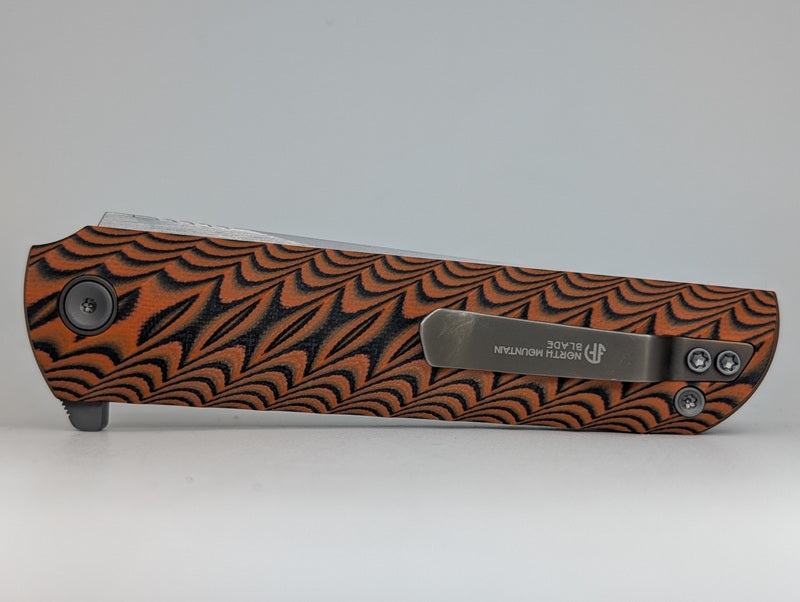 *Consignment* North Mountain Blade "Kick Stop Chop" Orange G10 SLD Magic Liner Lock Folding Knife
