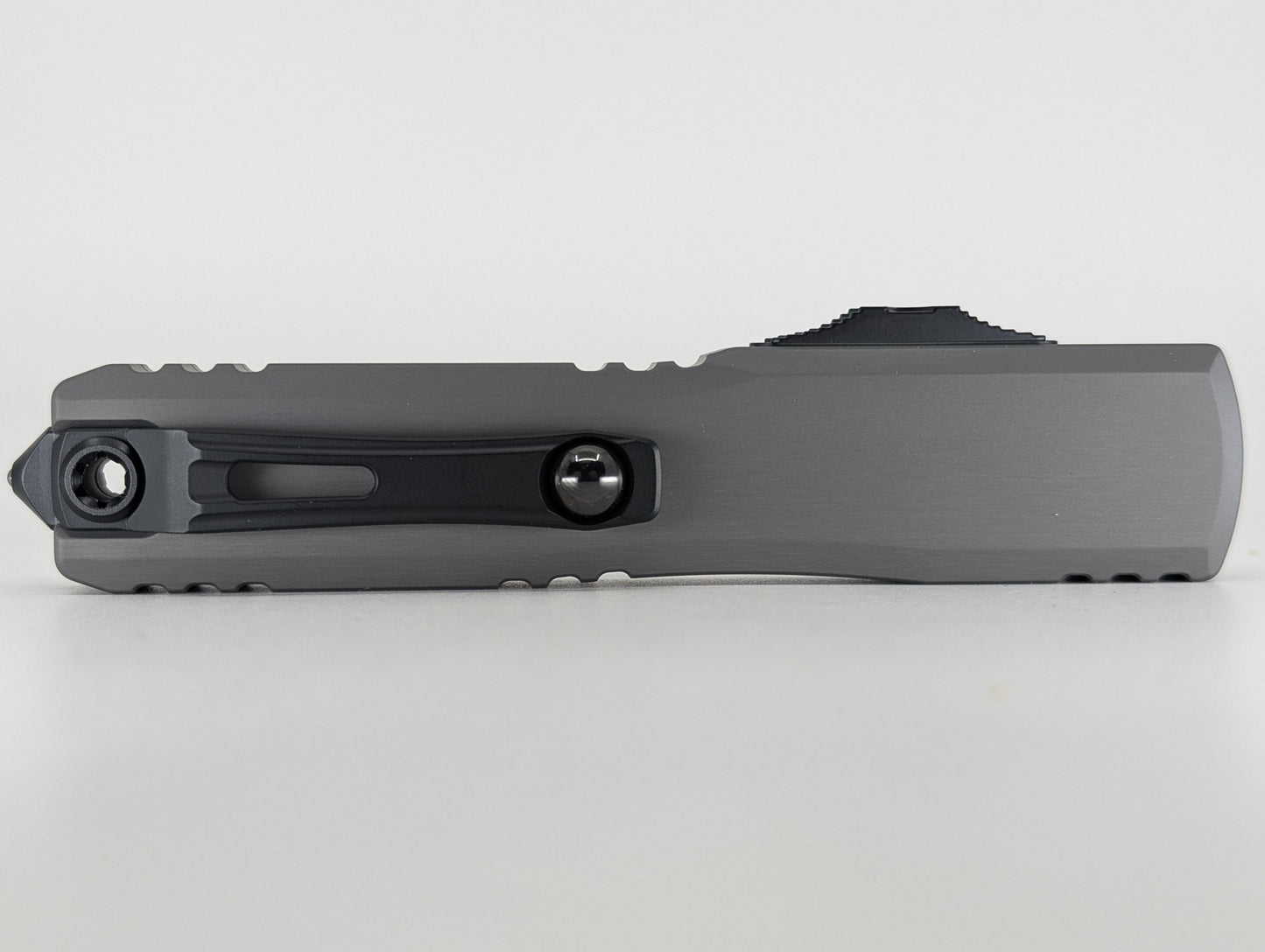 Microtech Ultratech ZBP T/E Natural Clear | Black Partial Serrated Blade Out the Front Knife