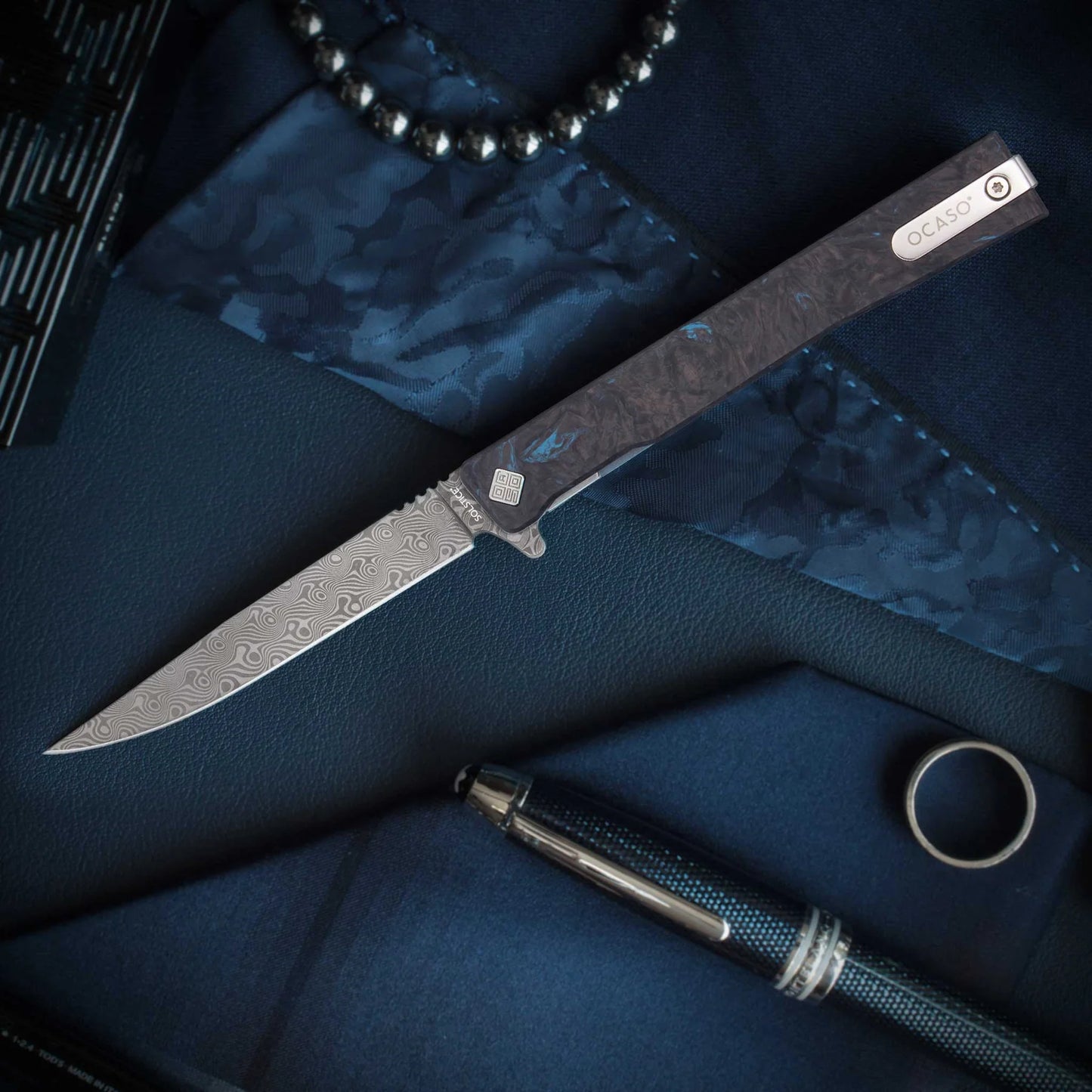 Ocaso Damascus Solstice Dark Matter Blue Framelock Folding Knife