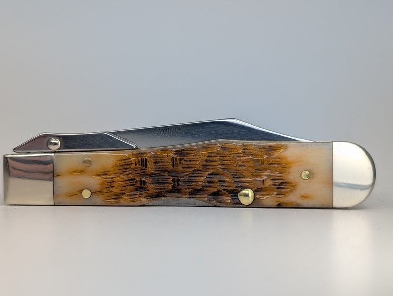 Case Knives Amber Bone Peach Seed Jig Cheetah Cub Back Lock Folding Knife