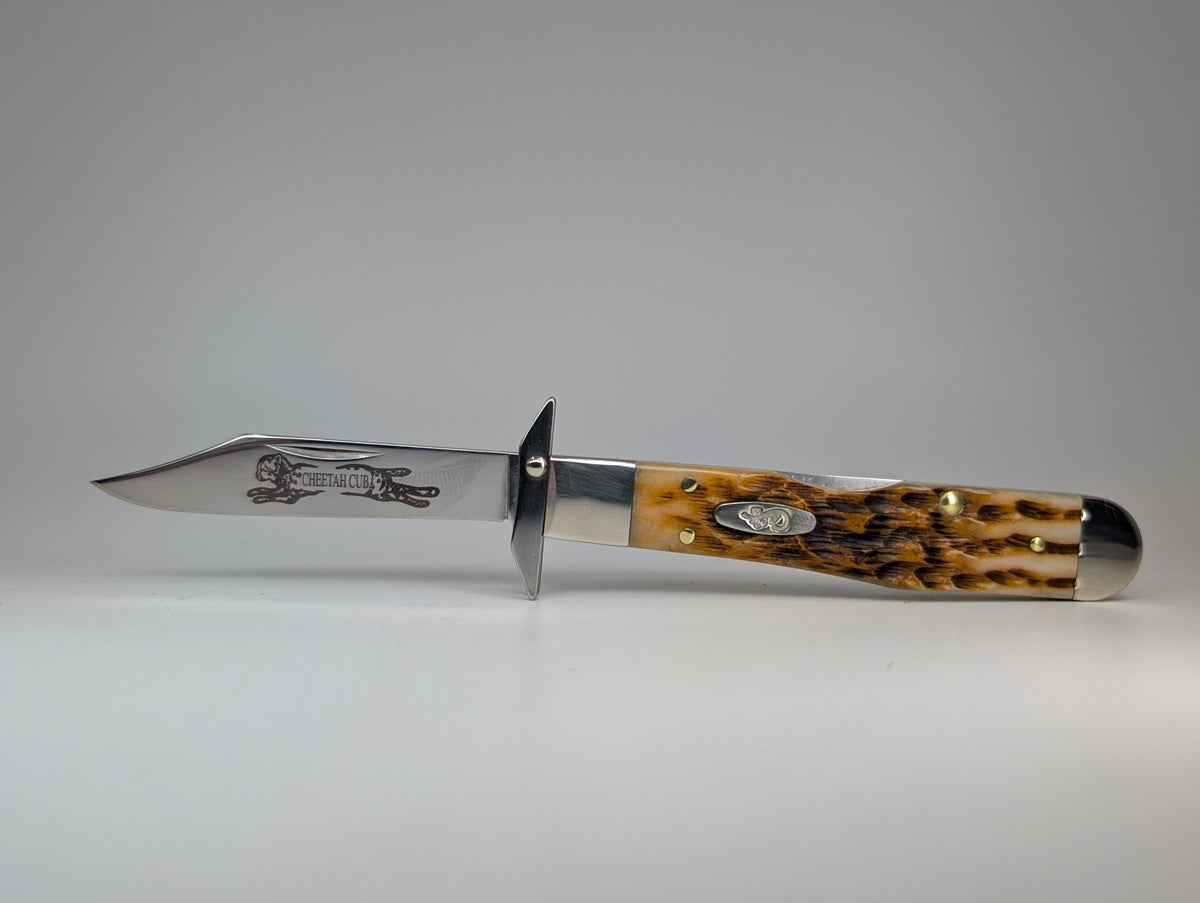 Case Knives Amber Bone Peach Seed Jig Cheetah Cub Back Lock Folding Knife