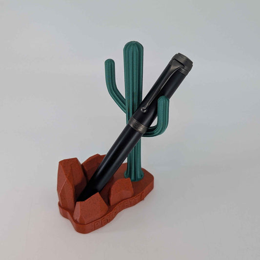 Pen in a cactus-shaped holder on a white background