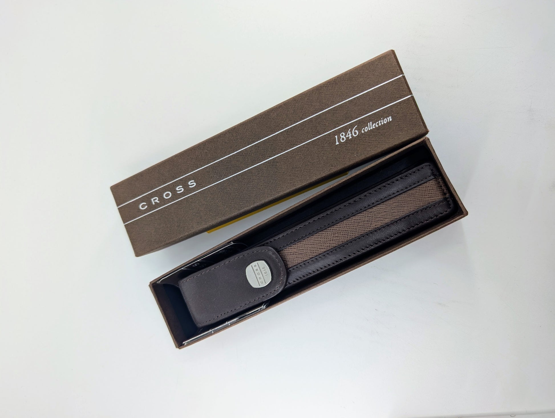 Cross Brown leather pen case with a silver buckle in an open box labeled '1849 collection' on a white background.