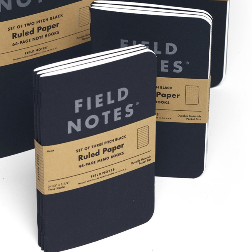 Field Notes notebooks with brown labels on a white background