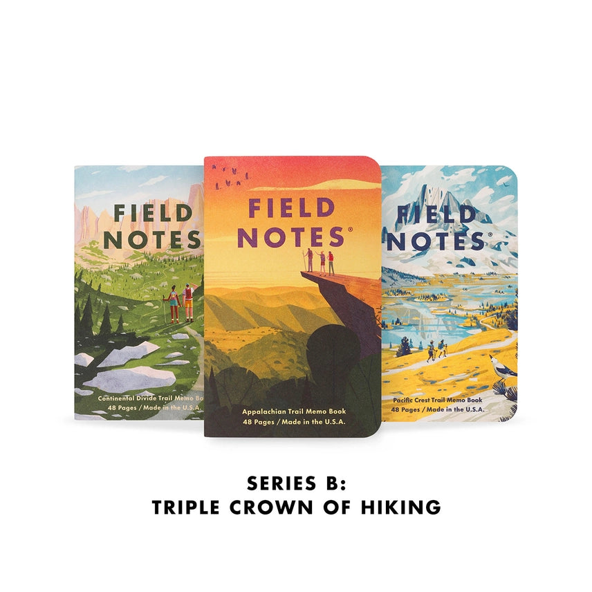 Three 'Field Notes' notebooks with scenic covers on a white background