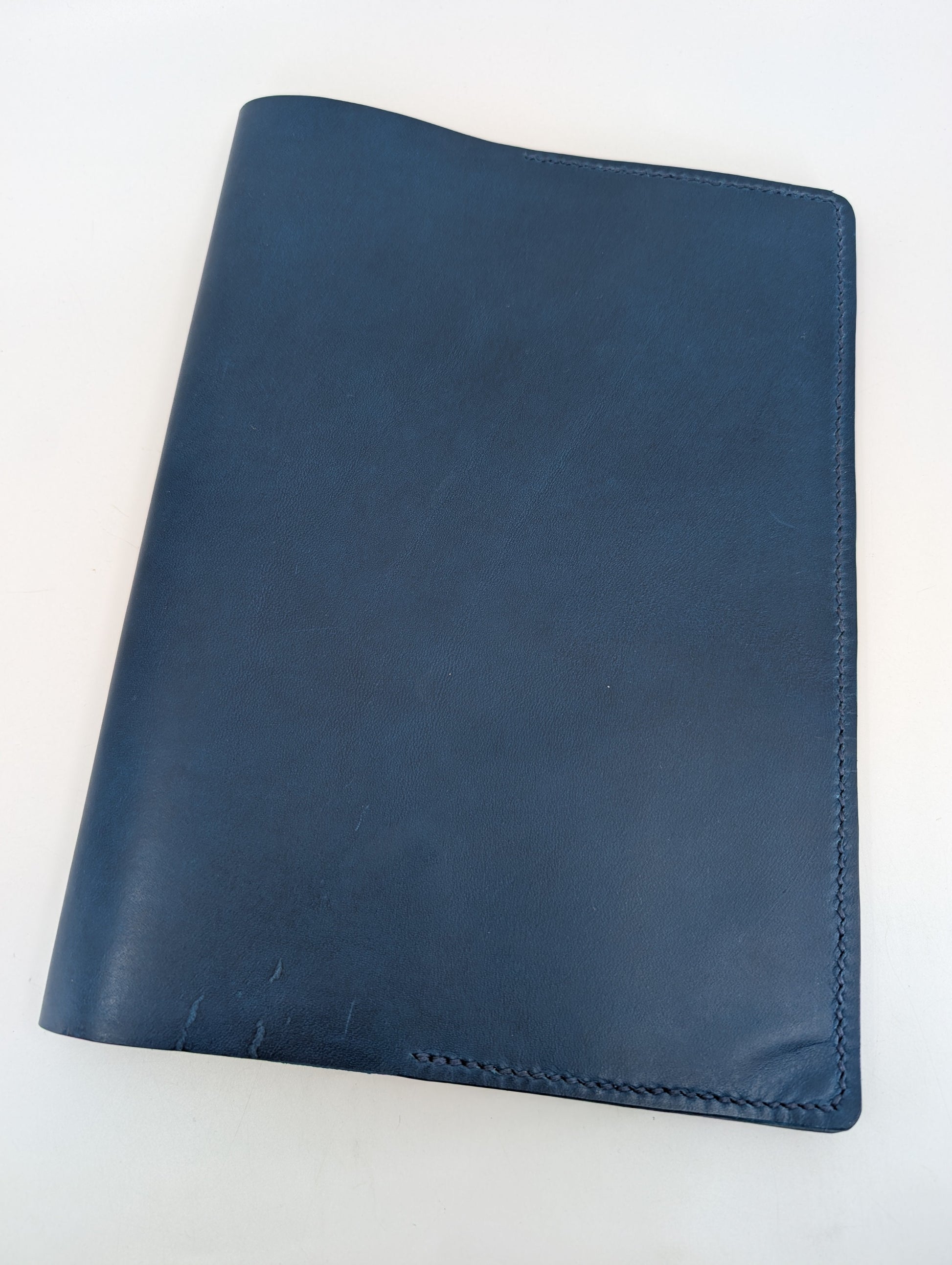 Blue leather folio on a white background