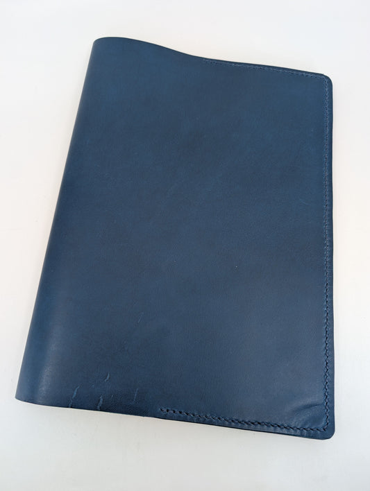 Blue leather folio on a white background