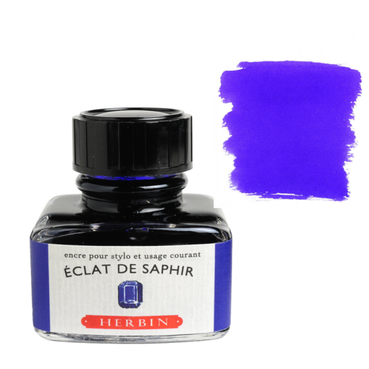 Bottle of Herbin ink with a swatch of blue color on a white background