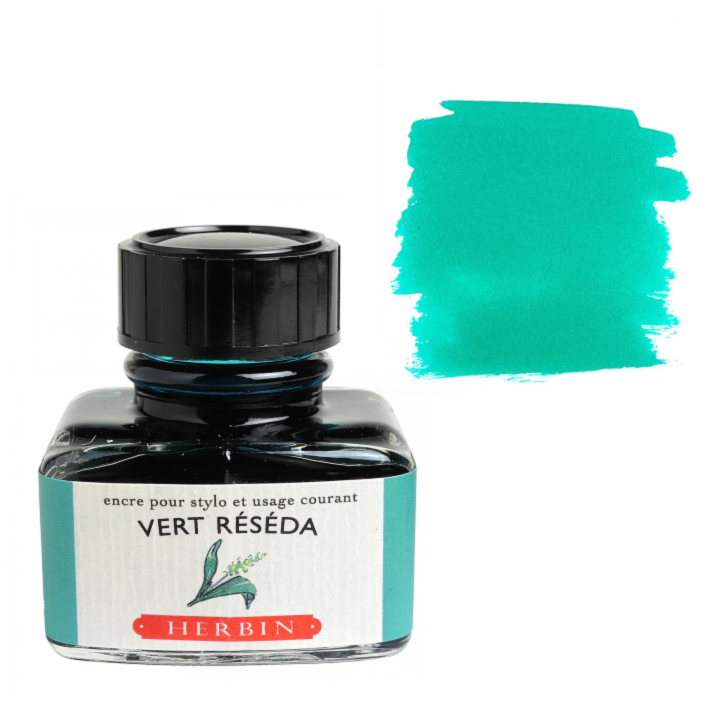 Bottle of Herbin Vert Reséda ink with a color swatch on a white background