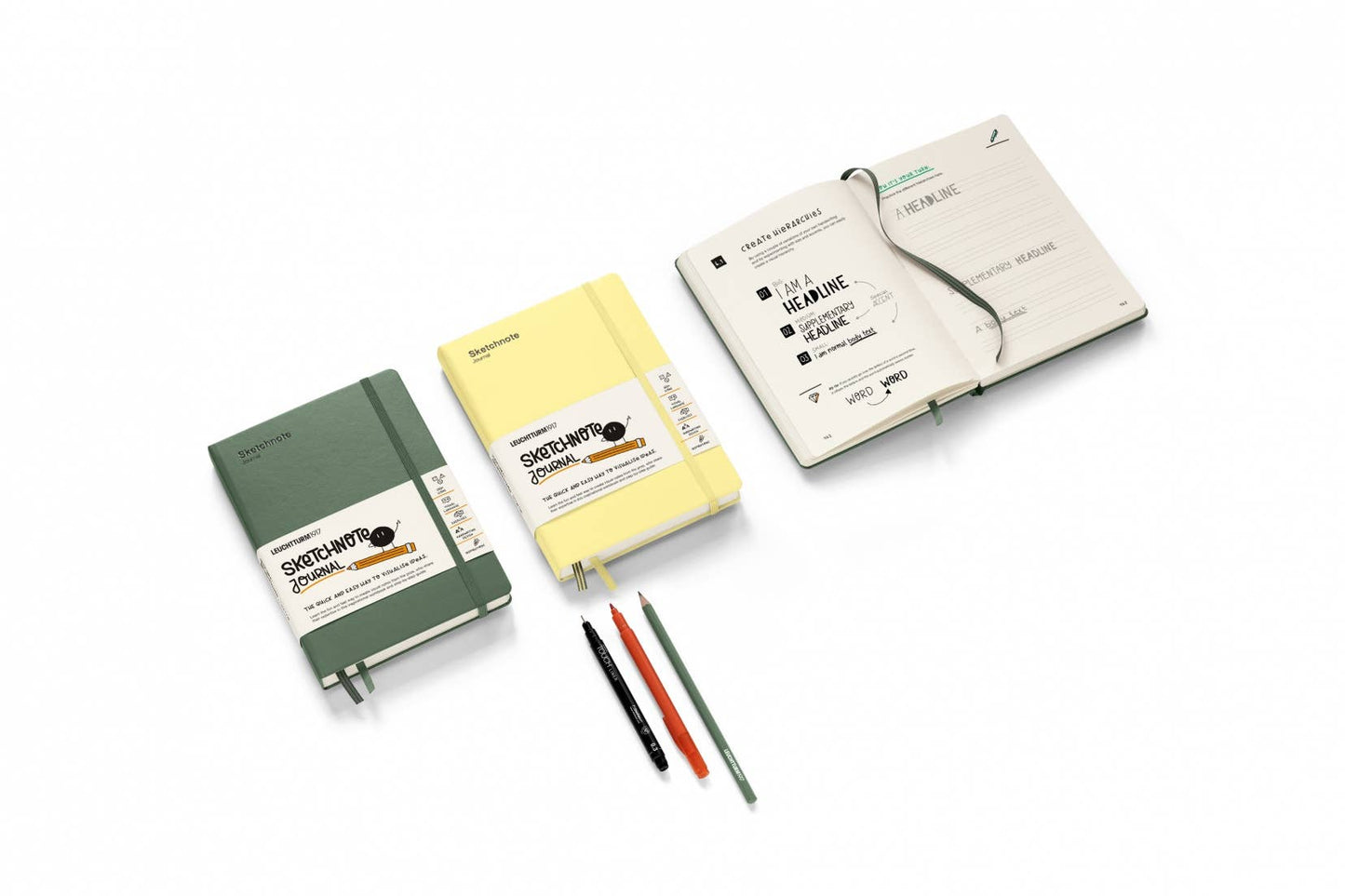 Three notebooks in green, yellow, and white with pens on a white background