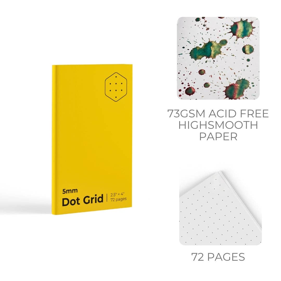 Yellow notebook with dot grid and splatter design paper on a white background