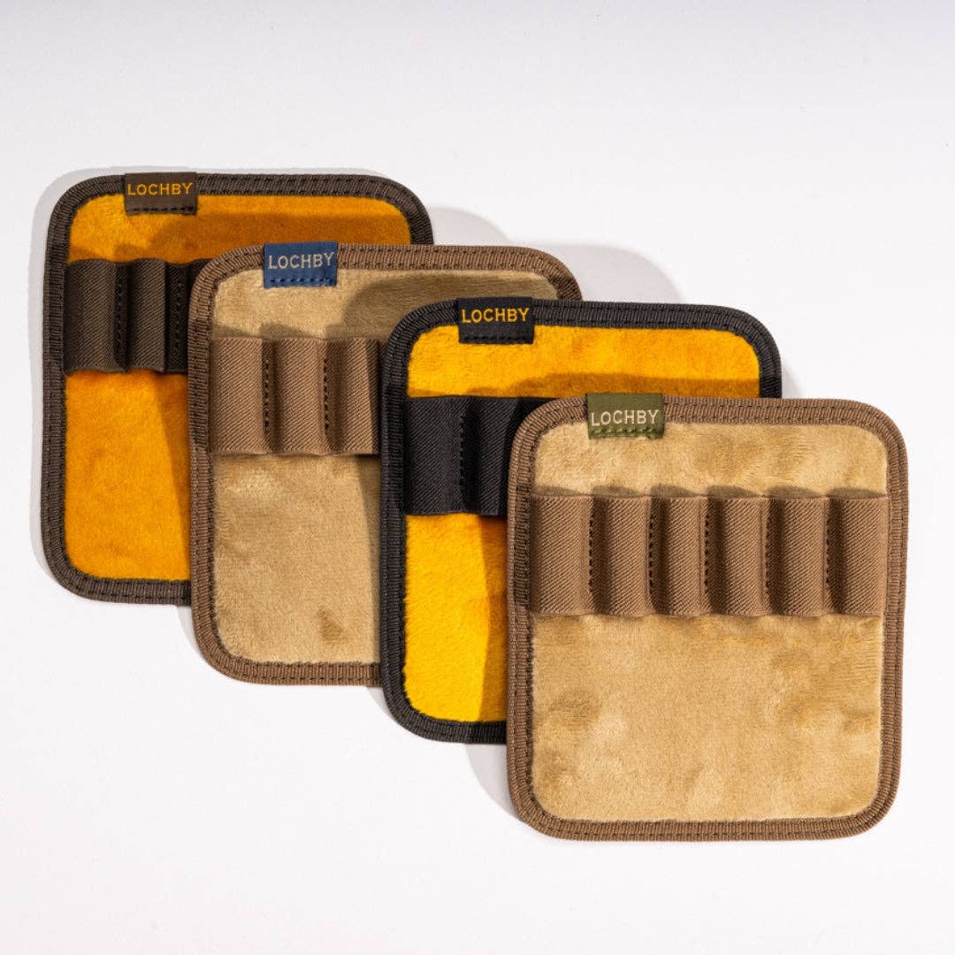 Set of four brown and yellow pen boards with 'Lochby' branding on a white background