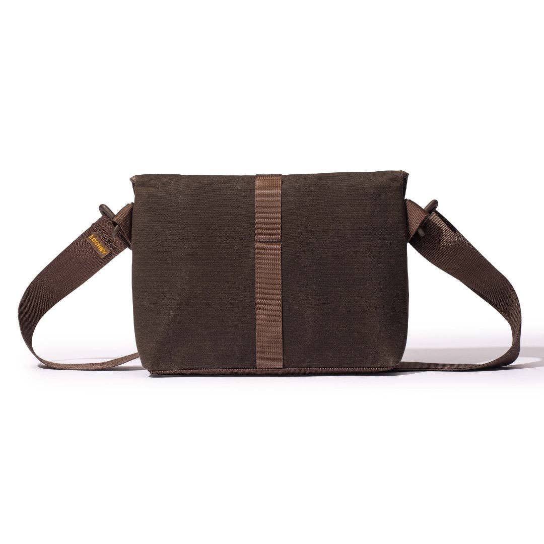 Brown LOCHBY bag with a strap on a white background