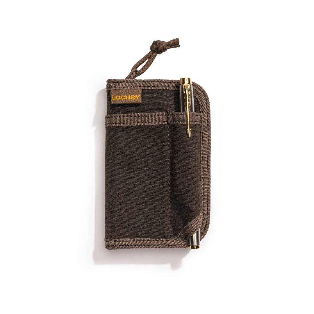 Brown travel wallet with a pen on a white background
