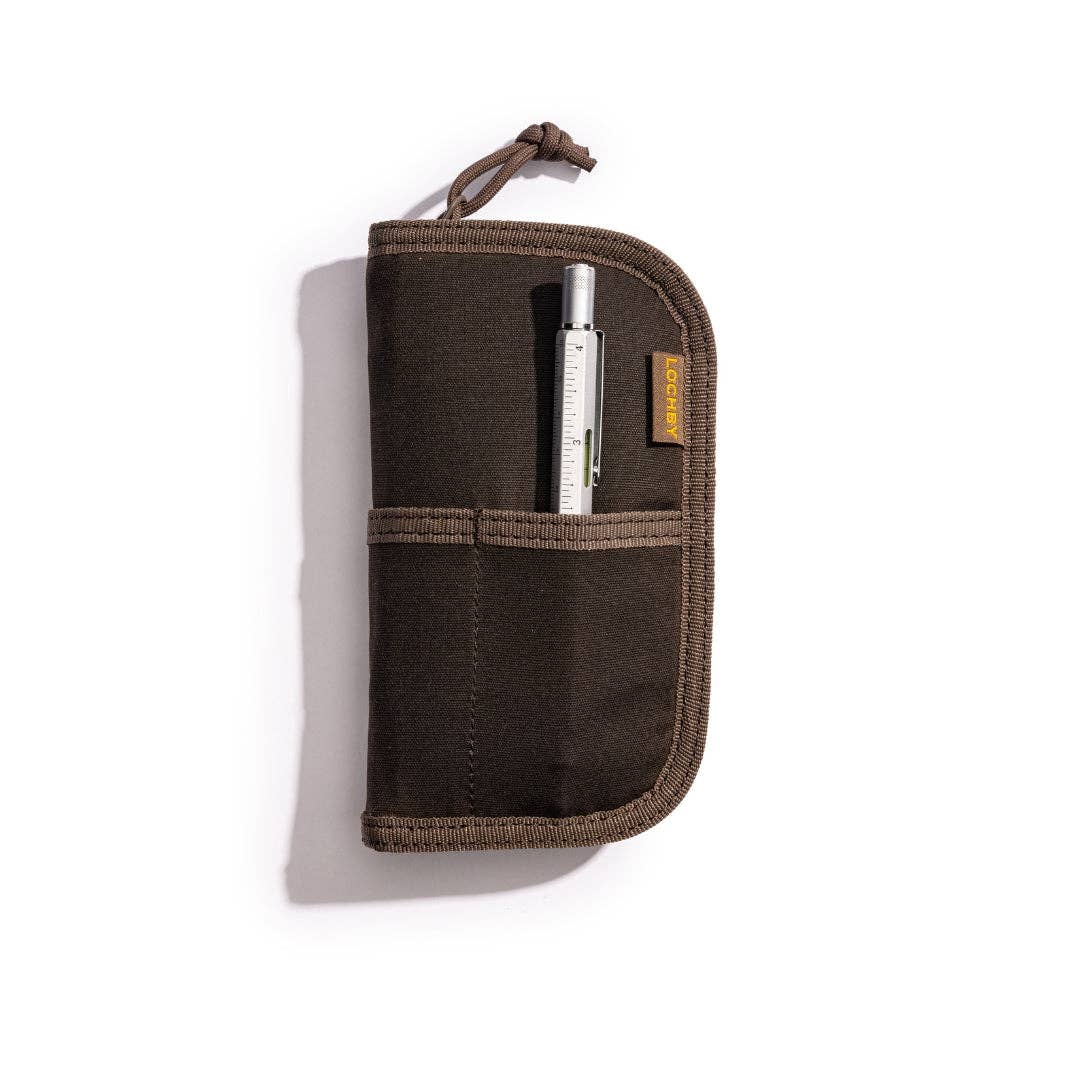 Brown LOCHBY_Quattro_V2 travel wallet with a pen inside on a white background
