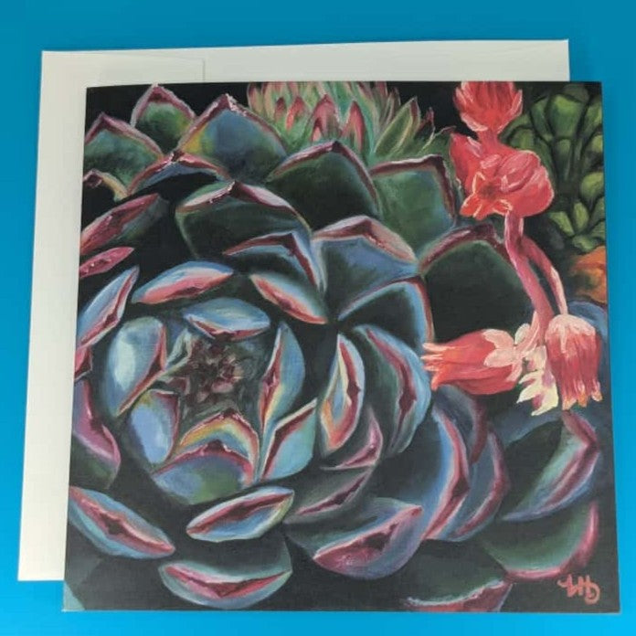 Greeting card with succulent plant design on a blue background