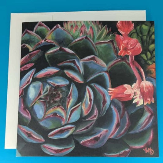 Greeting card with succulent plant design on a blue background
