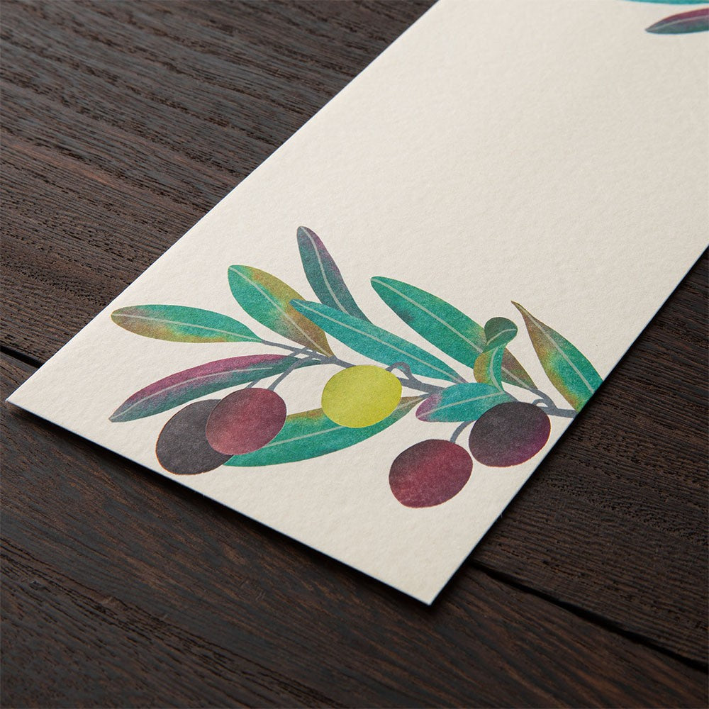 Midori Envelope Colorful illustration of olives on a white card against a wooden surface