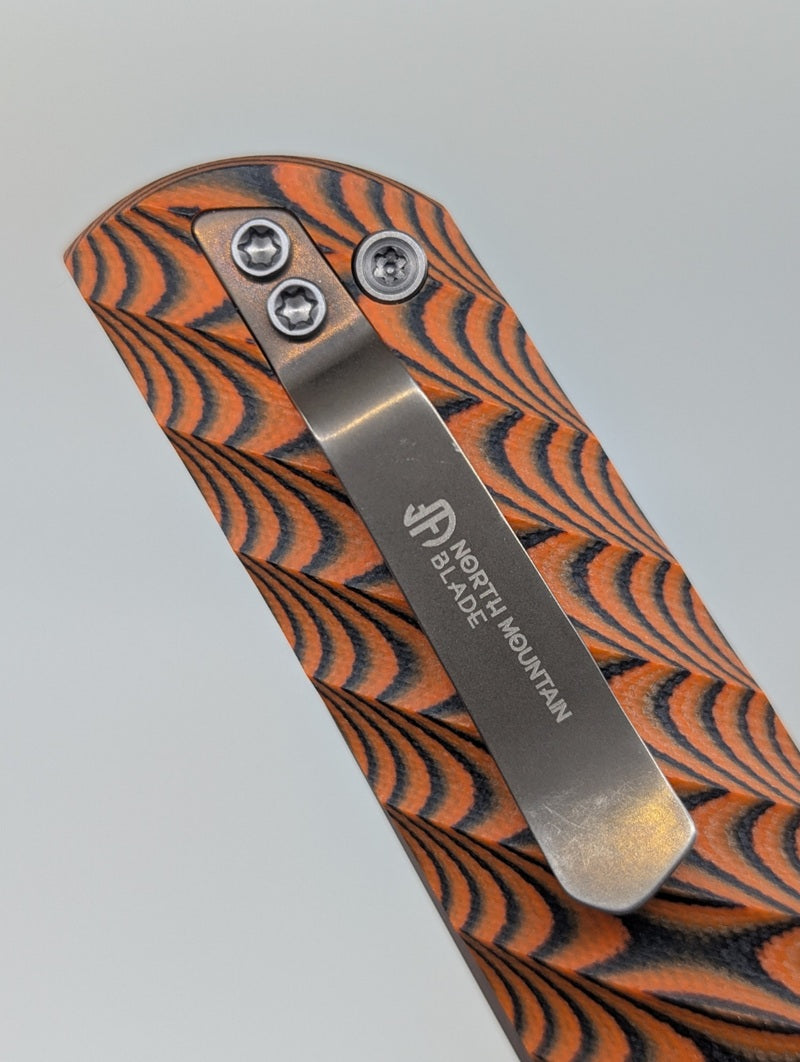 *Consignment* North Mountain Blade "Kick Stop Chop" Orange G10 SLD Magic Liner Lock Folding Knife
