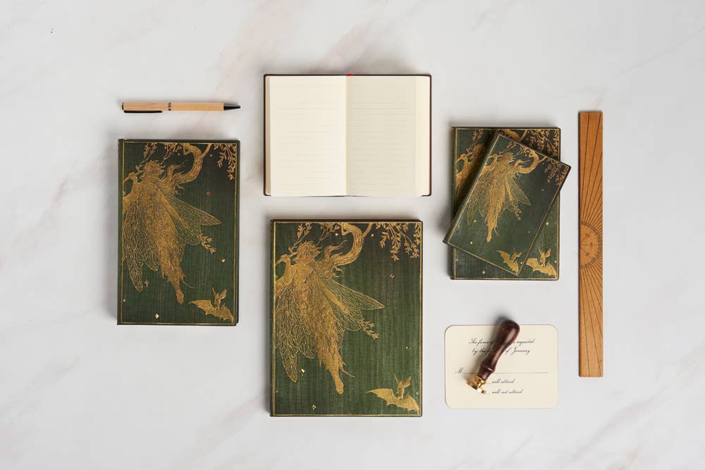 Set of green Paperblanks Olive Fairy Journal notebooks with fairy designs on a white surface