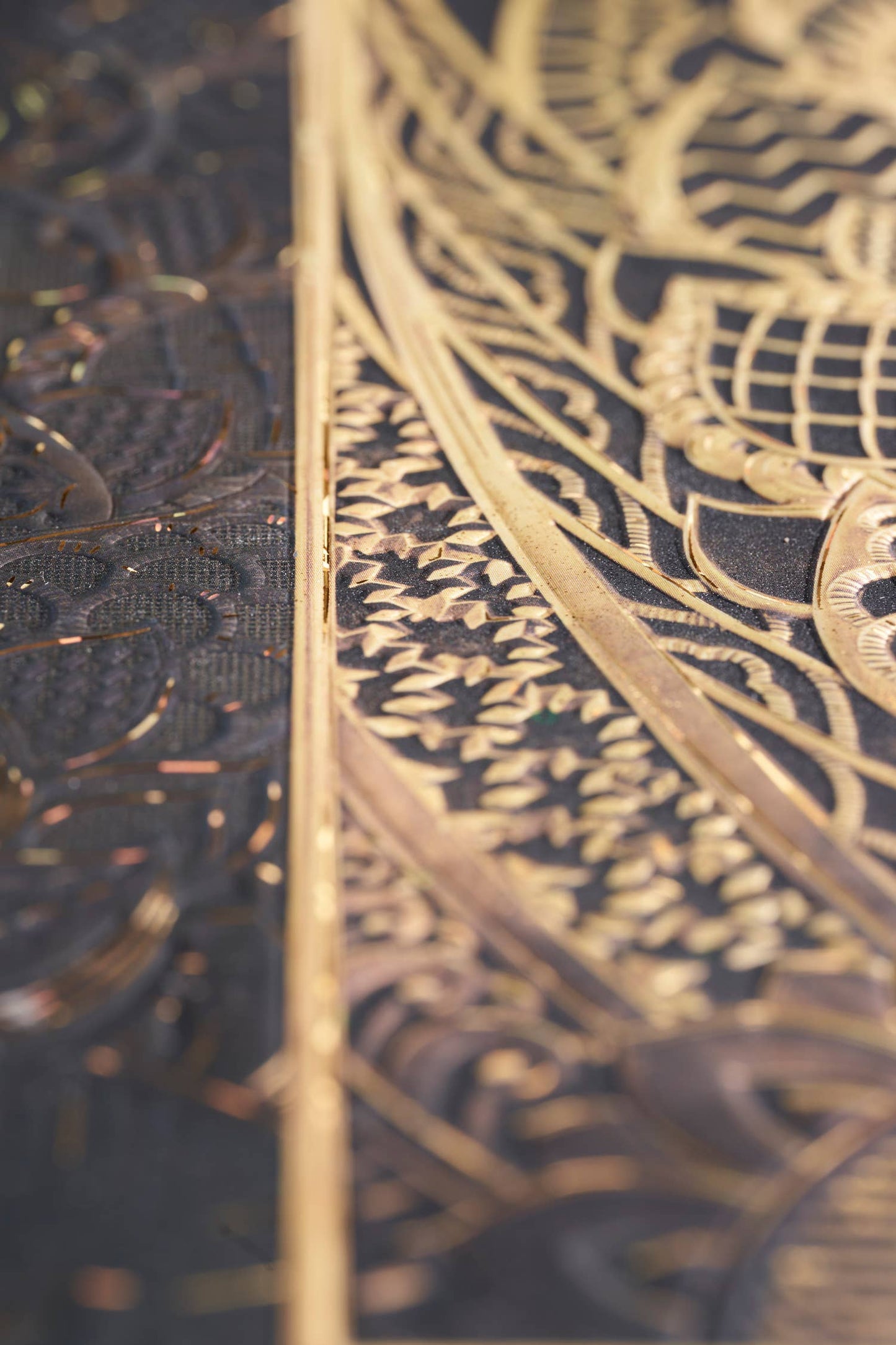 Close-up of a gold and black patterned object