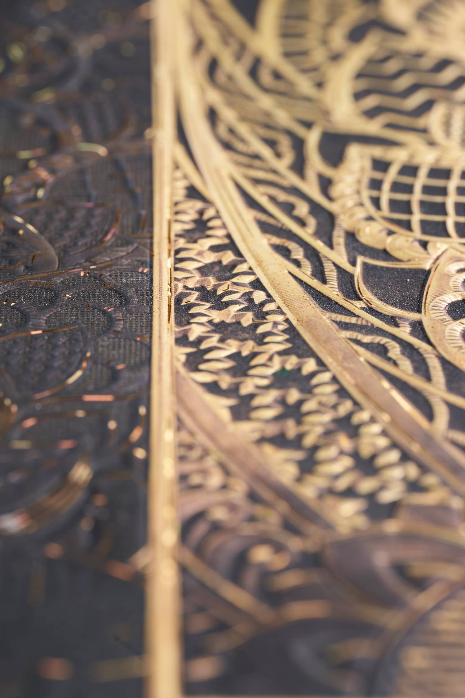 Close-up of a gold and black patterned object