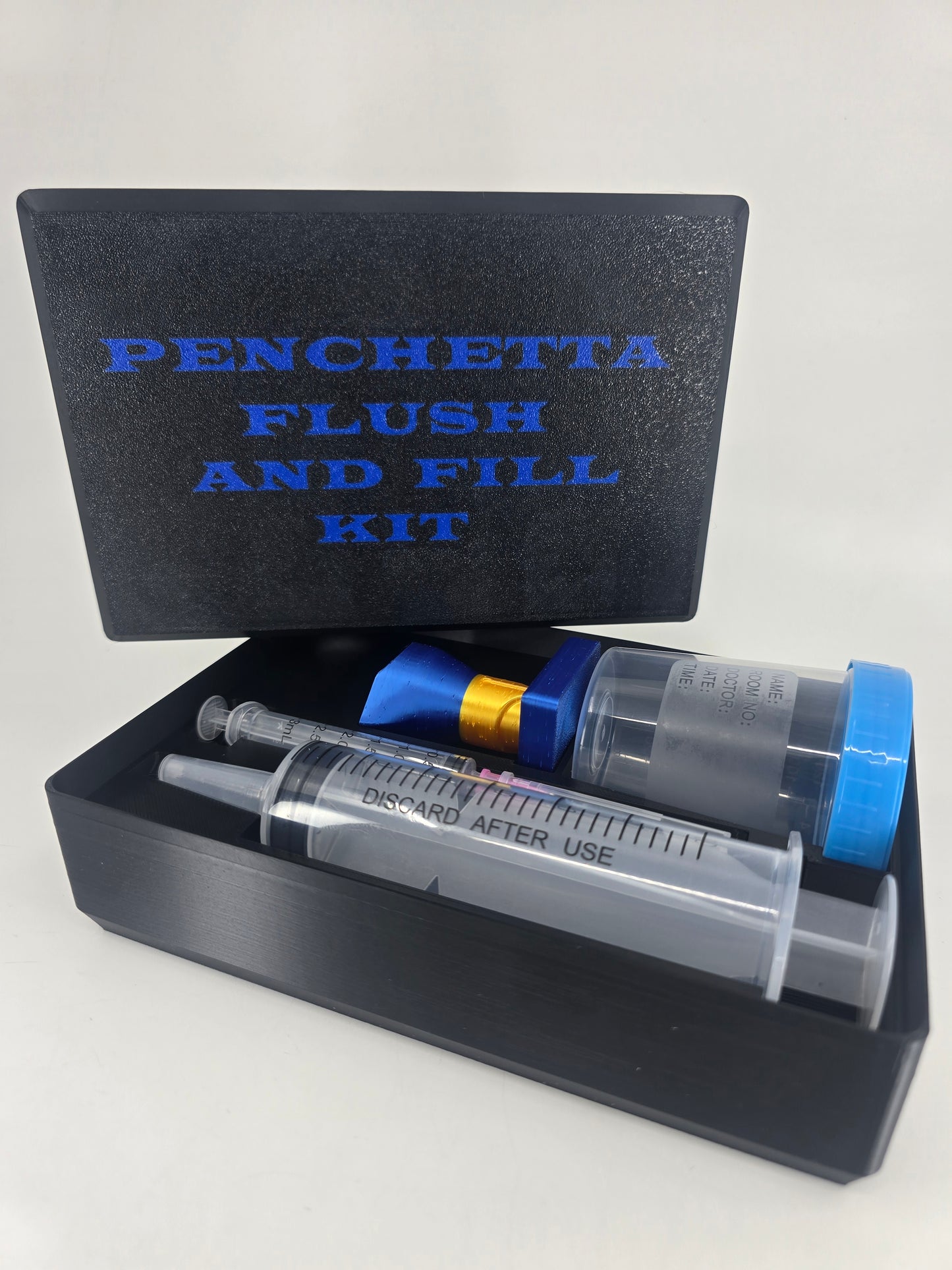 Penchetta Flush and Fill Kit with syringe and container on a white background