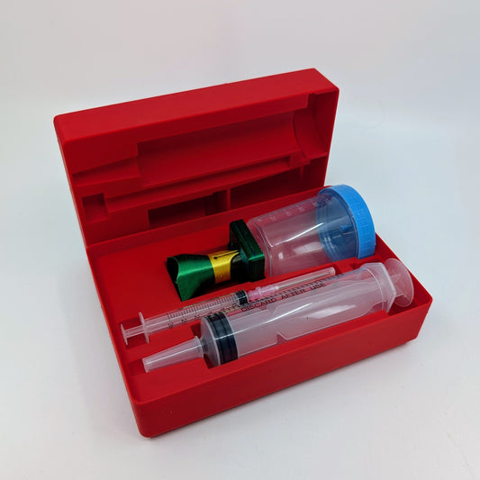 Penchetta Red pen maintenance kit with syringe and other components on a white background