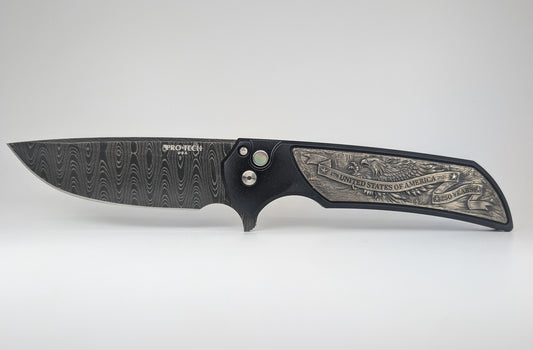 A ProTech folding pocket knife with a Damascus steel blade and an intricately engraved silver handle, displayed horizontally against a light gray background.