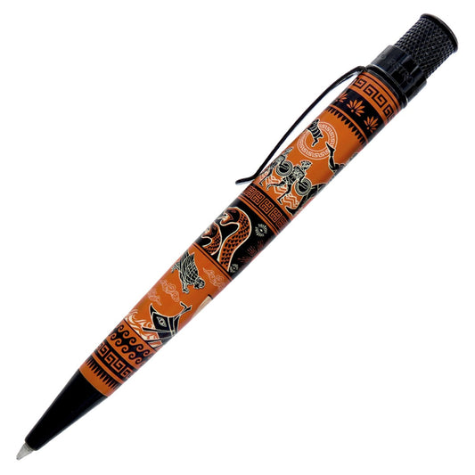 A ballpoint pen with a black textured grip and tip, decorated with an orange and black tribal-style graphic pattern, shown on a plain white background.