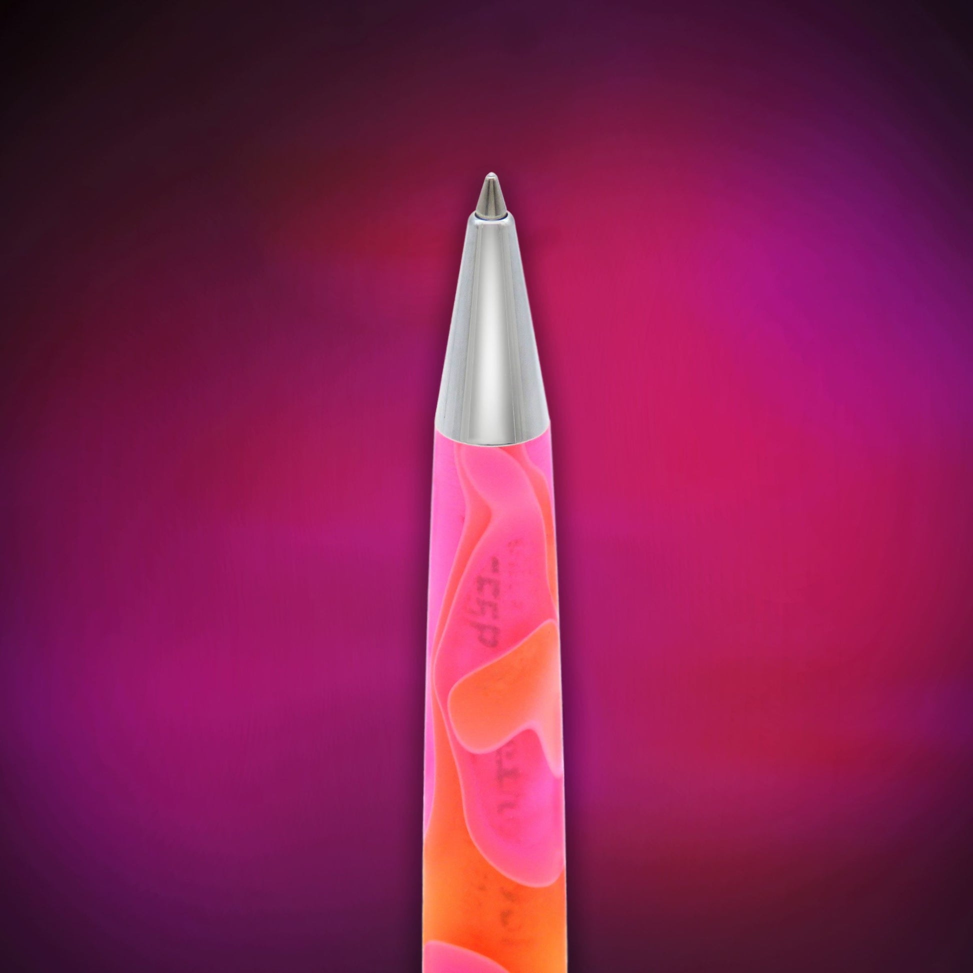 A slim retractable pen with a metallic silver tip and a translucent pink and orange body, centered against a dark purple and magenta gradient background.