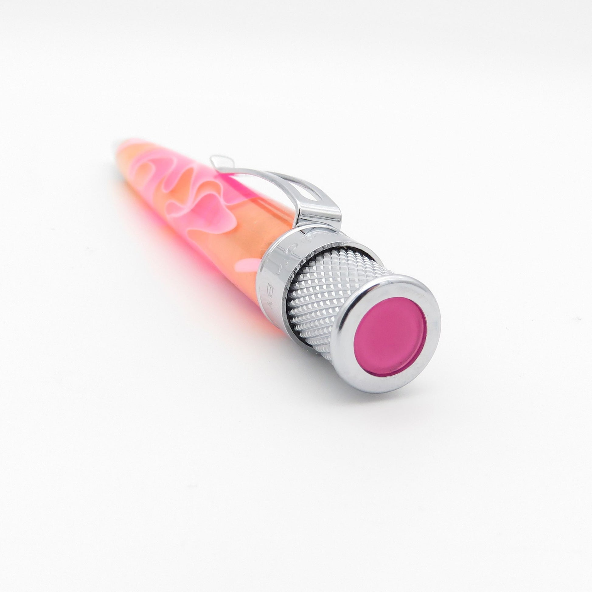 A novelty lava pen with a translucent pink and orange body, featuring a silver metal clip and textured silver end caps with a pink center.