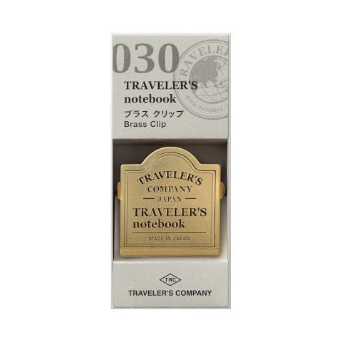 Traveler's notebook brass clip packaging on a white background